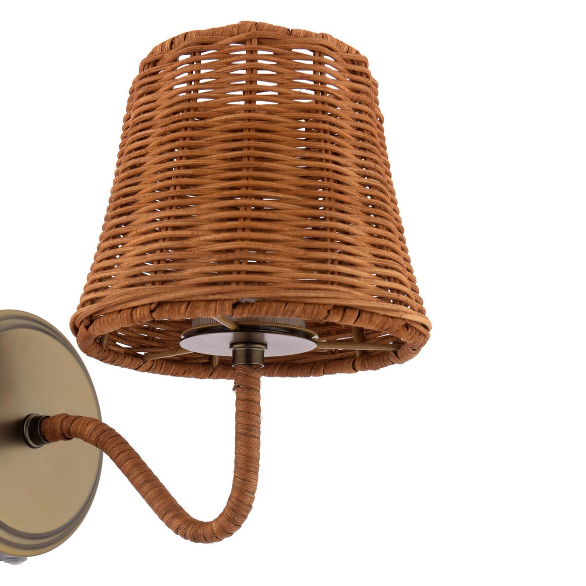 Wall sconce with a woven rattan shade and a wrapped arm on a circular brass backplate