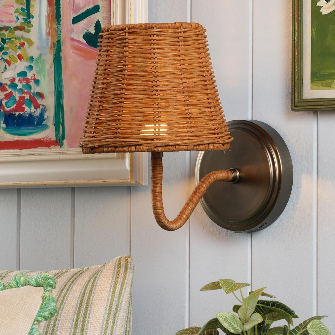 Joules Elcot rechargeable wall light with satin bronze finish and dark rattan shade mounted on a wall
