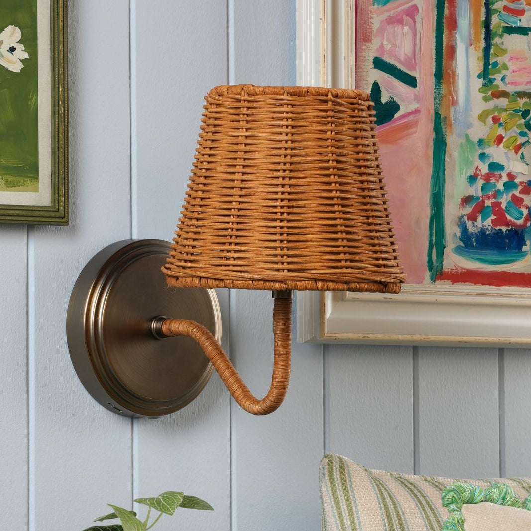 Joules Elcot rechargeable wall light in satin bronze with a dark rattan shade