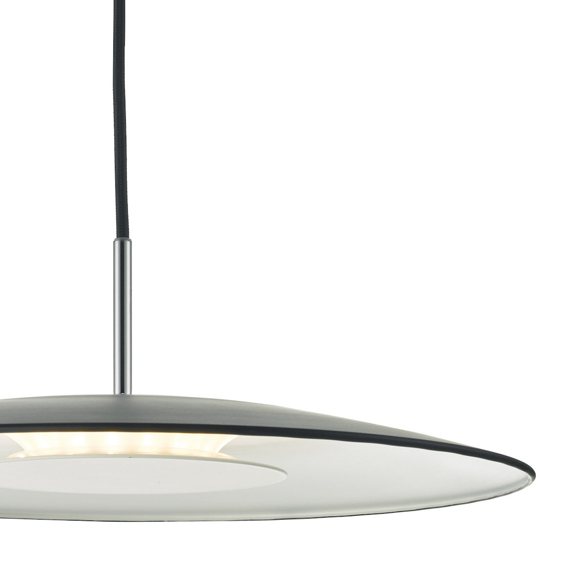 Close up of a pendant light with a black cord and a silver rod connecting to a flat, round, grey shade