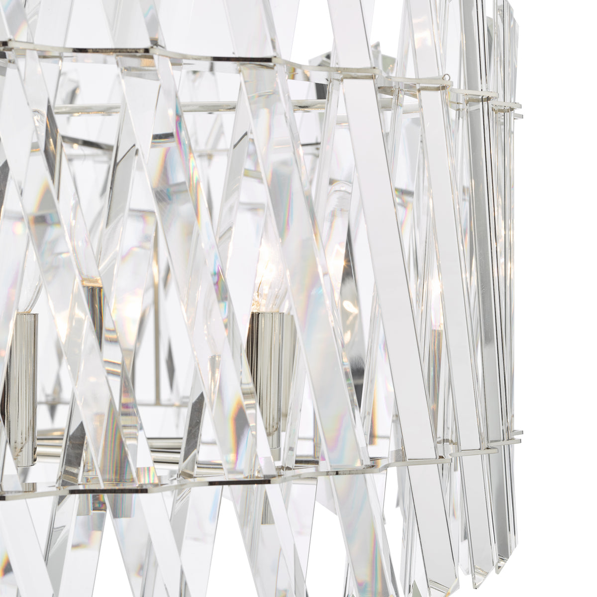Close up of a crystal chandelier with lightbulbs visible through the clear panels