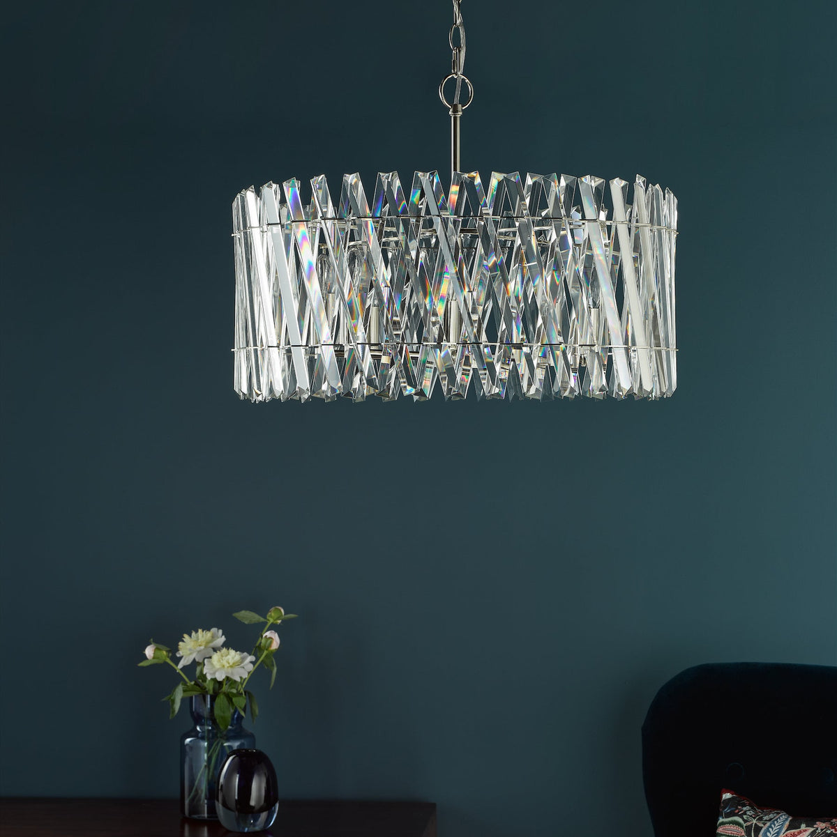 Rectangular crystal chandelier with silver frame hanging from ceiling