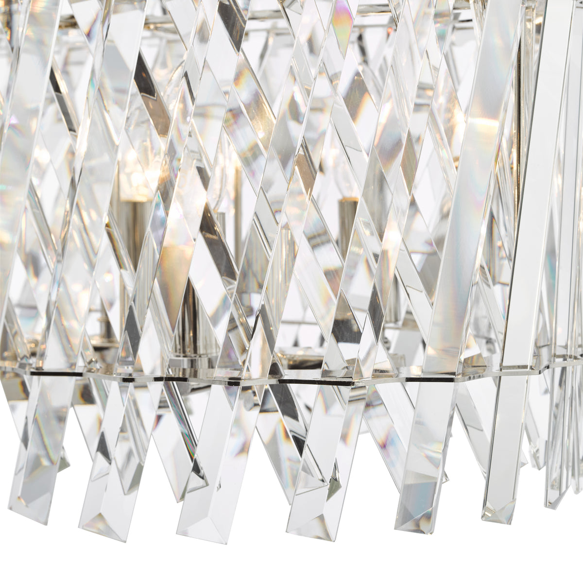 Close up of a crystal chandelier with lightbulbs visible through the clear, faceted crystals