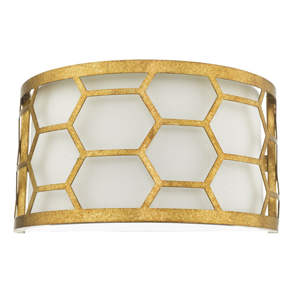 Gold honeycomb pattern wall sconce with a white fabric shade