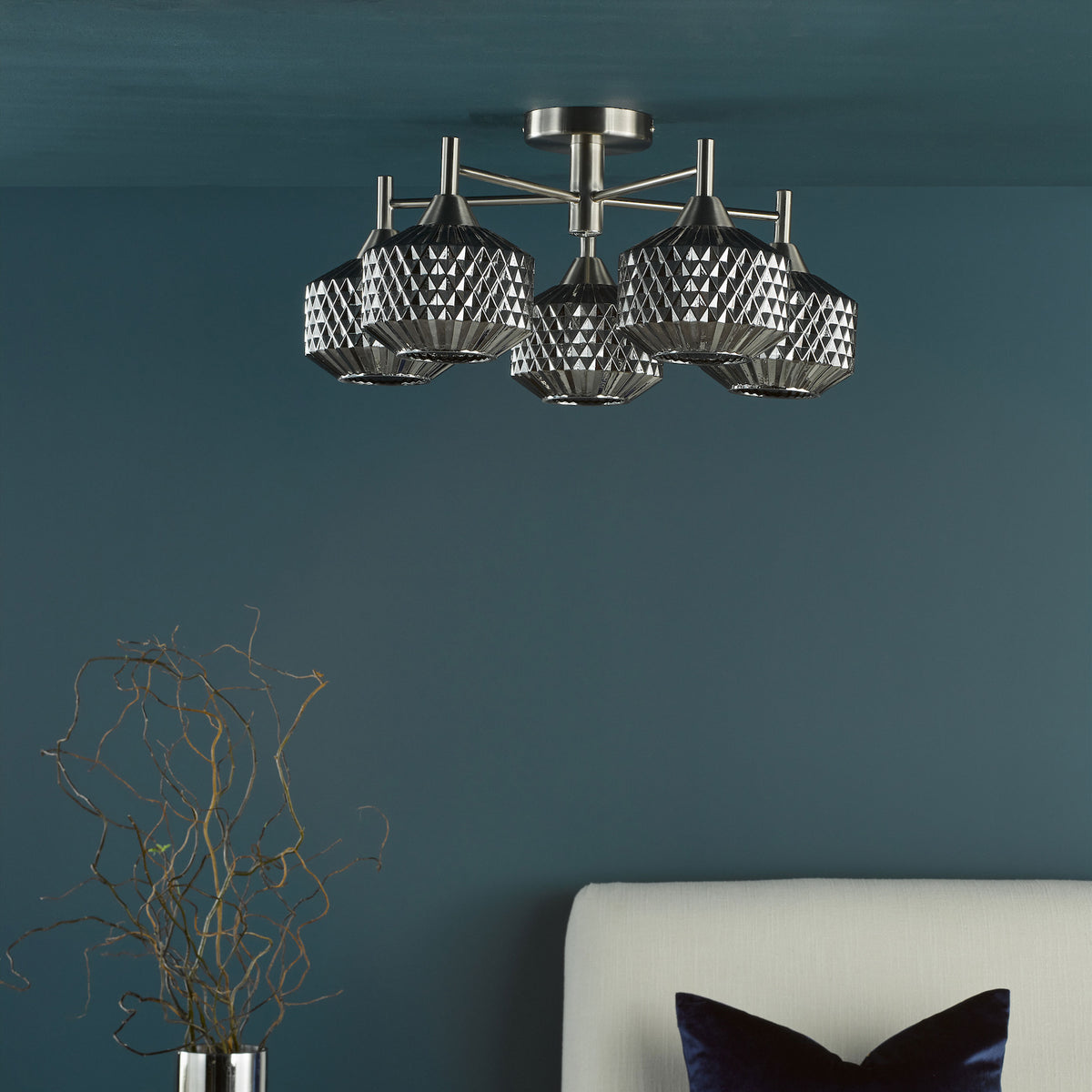 Brushed nickel ceiling light with four geometric shades