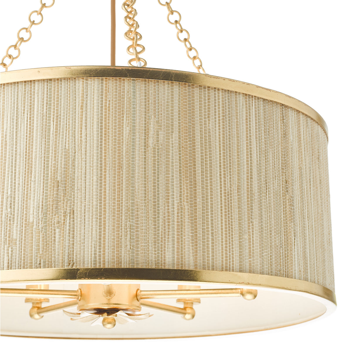 Close-up of a gold and woven drum chandelier with a white interior.