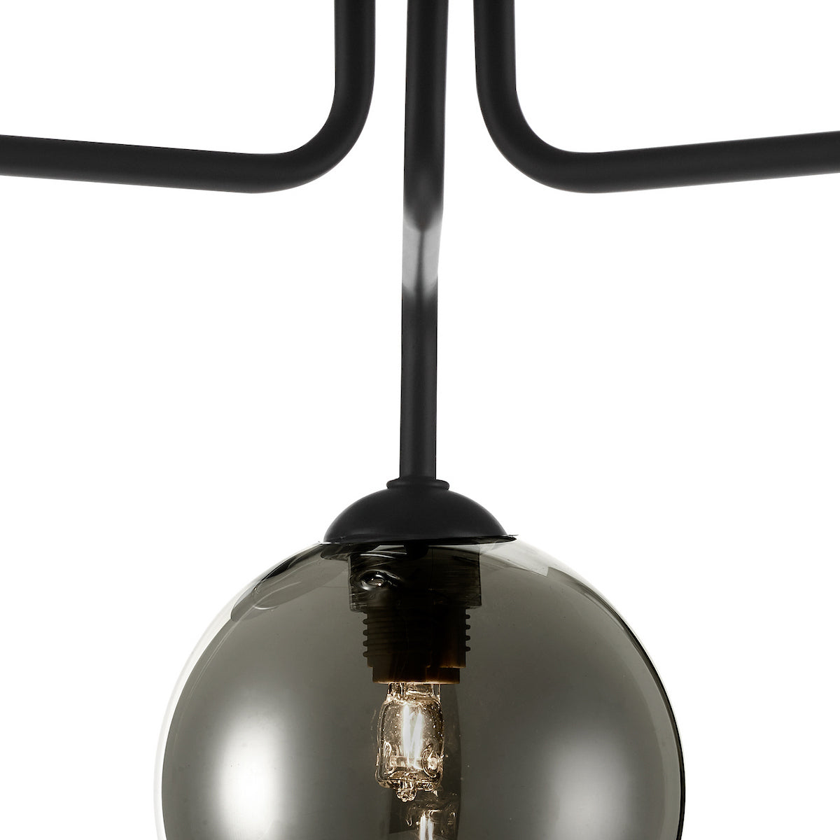 Close-up of a black chandelier arm with a smoked glass globe shade and exposed bulb.