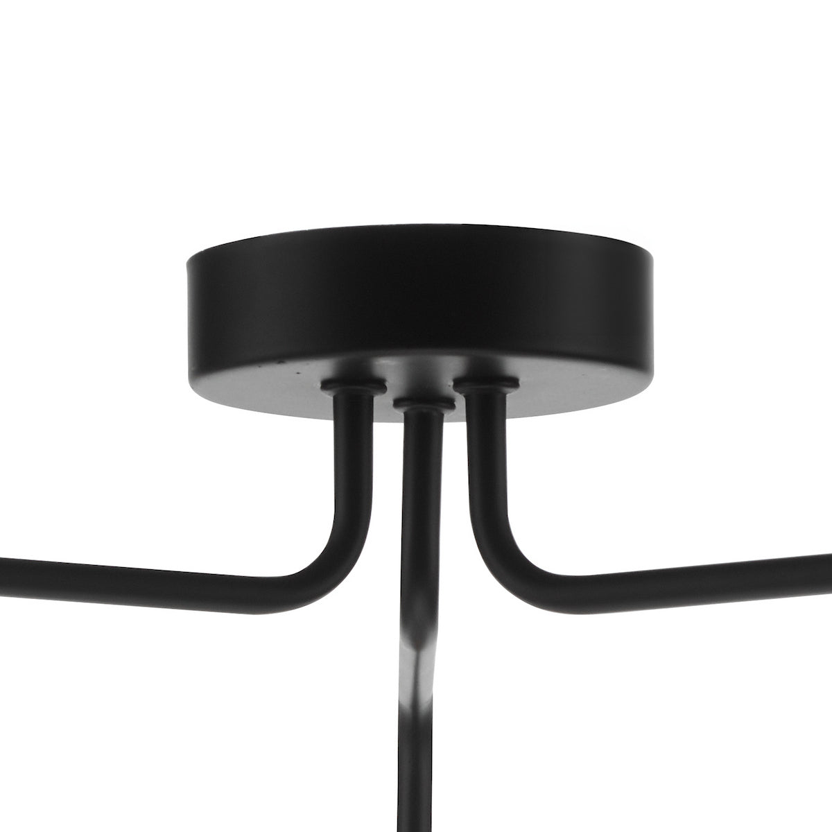 Close-up of a black ceiling rose with three curved arms extending outwards.