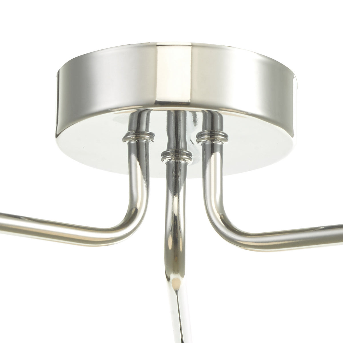 Close-up of a polished chrome ceiling rose with three curved arms extending downwards.