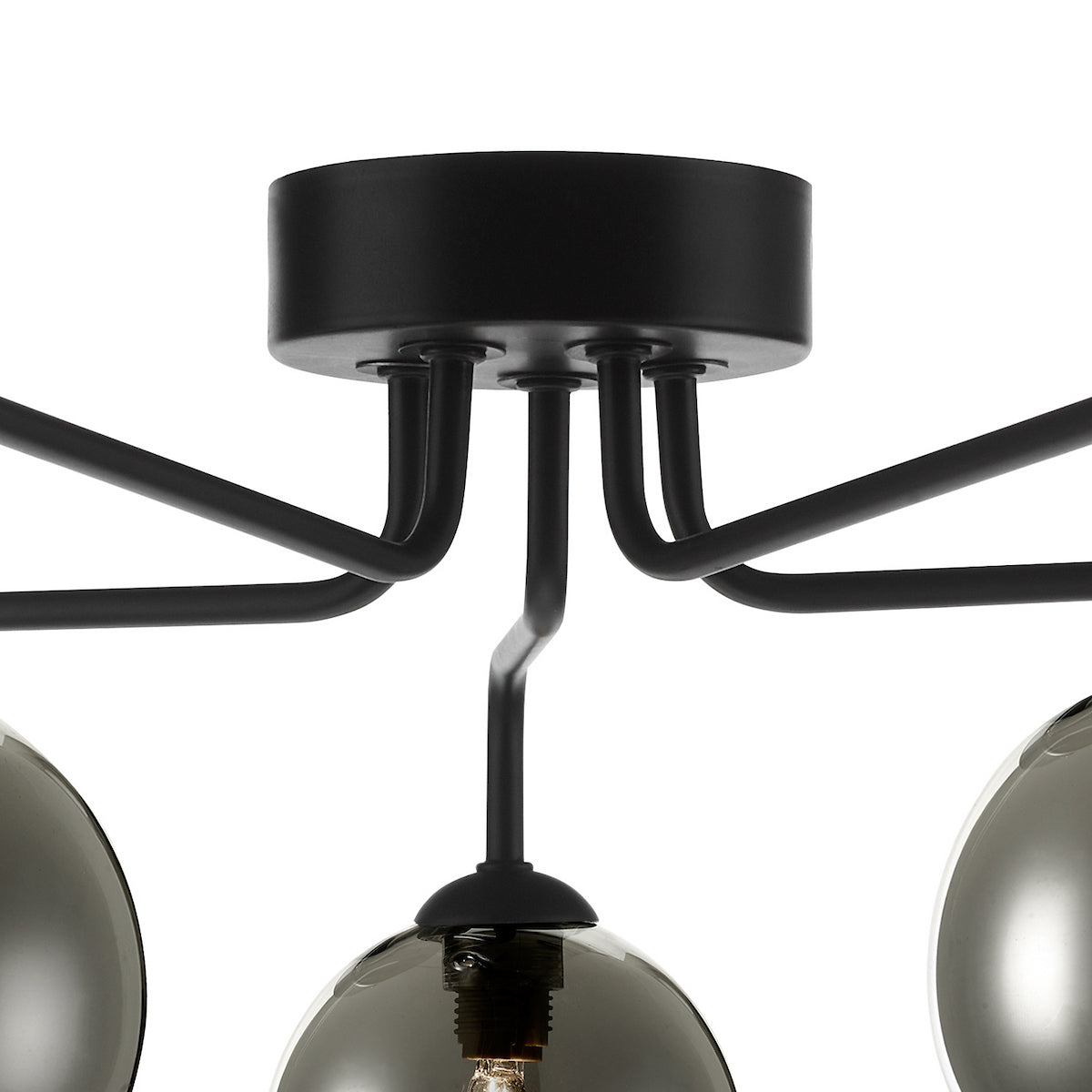 Close-up of a black ceiling light fixture with five arms and smoked glass globes.