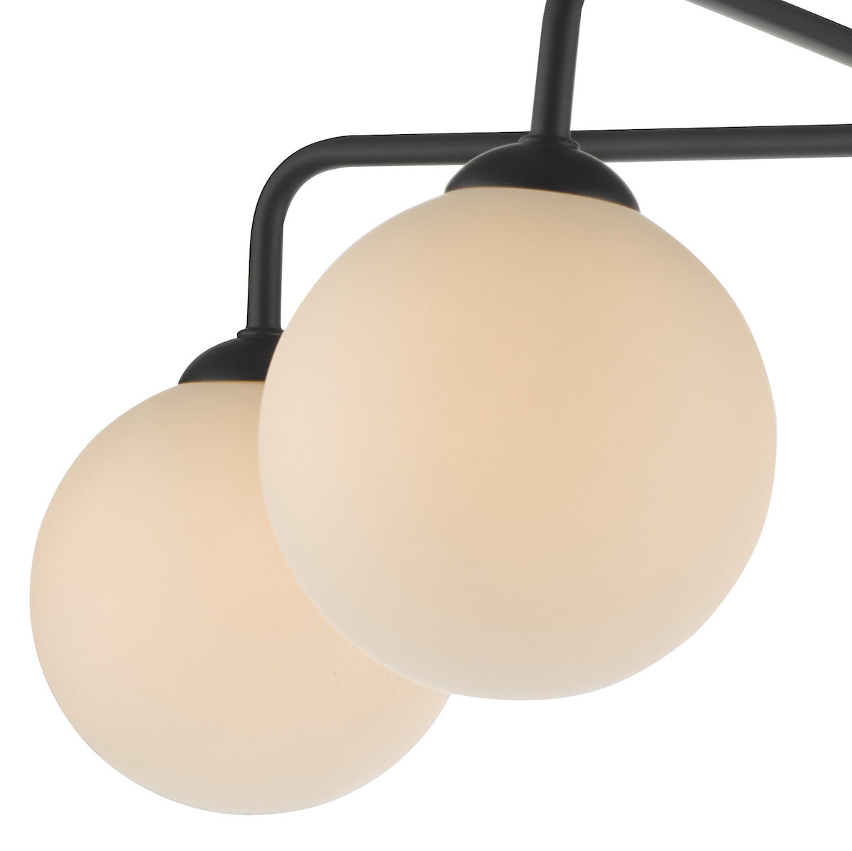 Close-up of a modern black chandelier with two spherical, frosted glass shades.