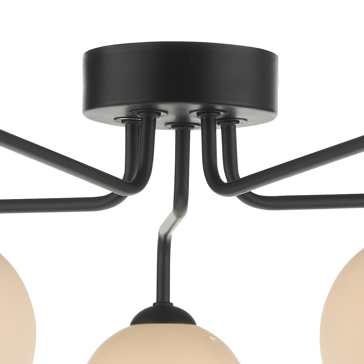 Close-up of a black ceiling light fixture with multiple arms and cream-colored globe shades.