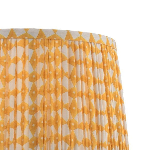 Pleated lampshade with yellow and white geometric diamond pattern