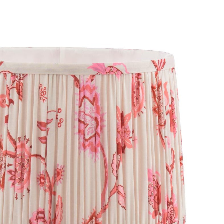 Pleated fabric lampshade with pink and red floral pattern on cream background
