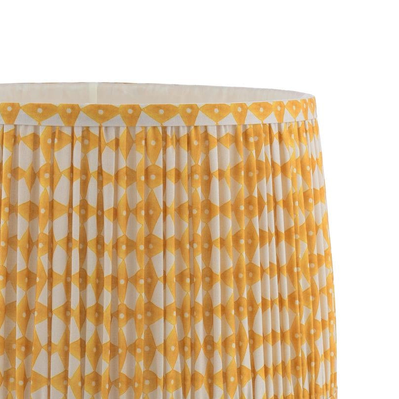 Pleated drum lampshade with yellow and white geometric diamond pattern