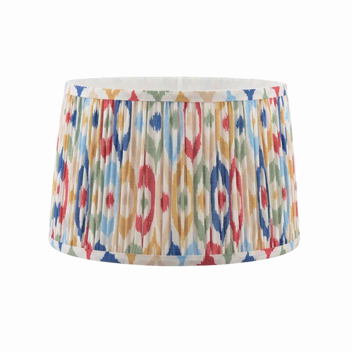 Drum lampshade with a pleated fabric texture and a colorful ikat pattern