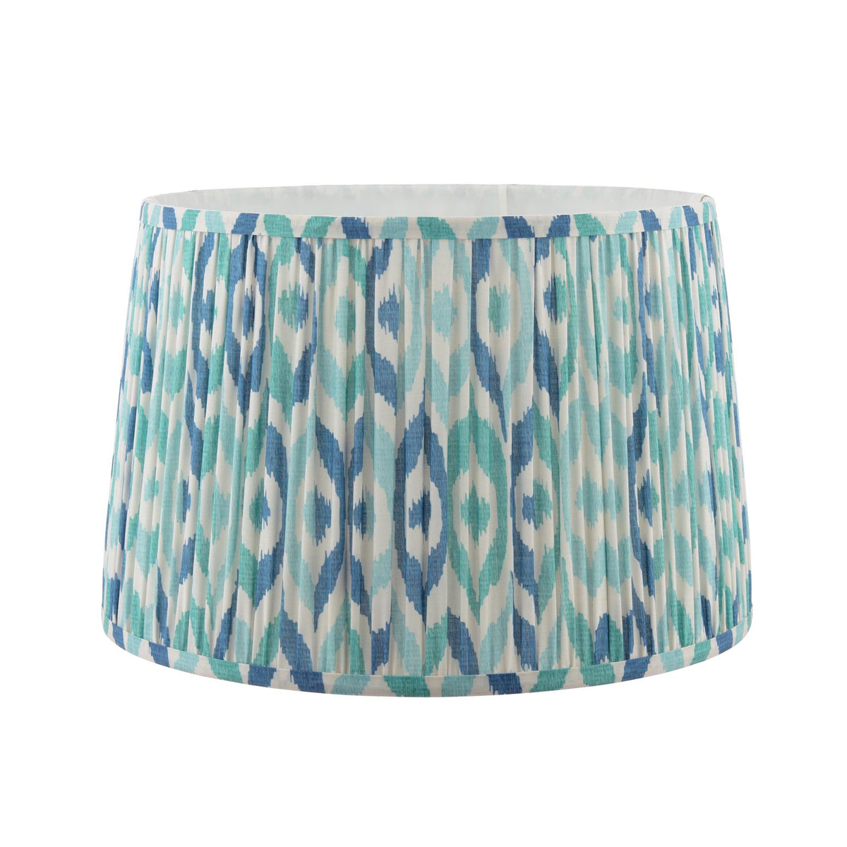 Drum lampshade with blue and teal ikat pattern and pleated fabric texture