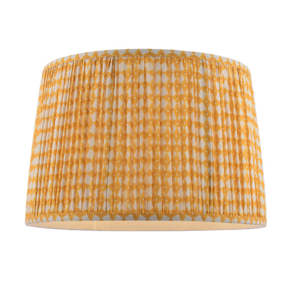 Drum lampshade with yellow and white geometric pattern and pleated fabric texture