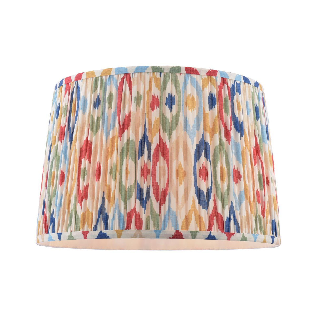 Drum lampshade with a pleated fabric texture and a colorful ikat geometric pattern