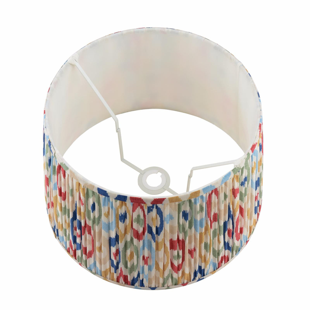 Drum lampshade with pleated fabric featuring a colorful ikat pattern