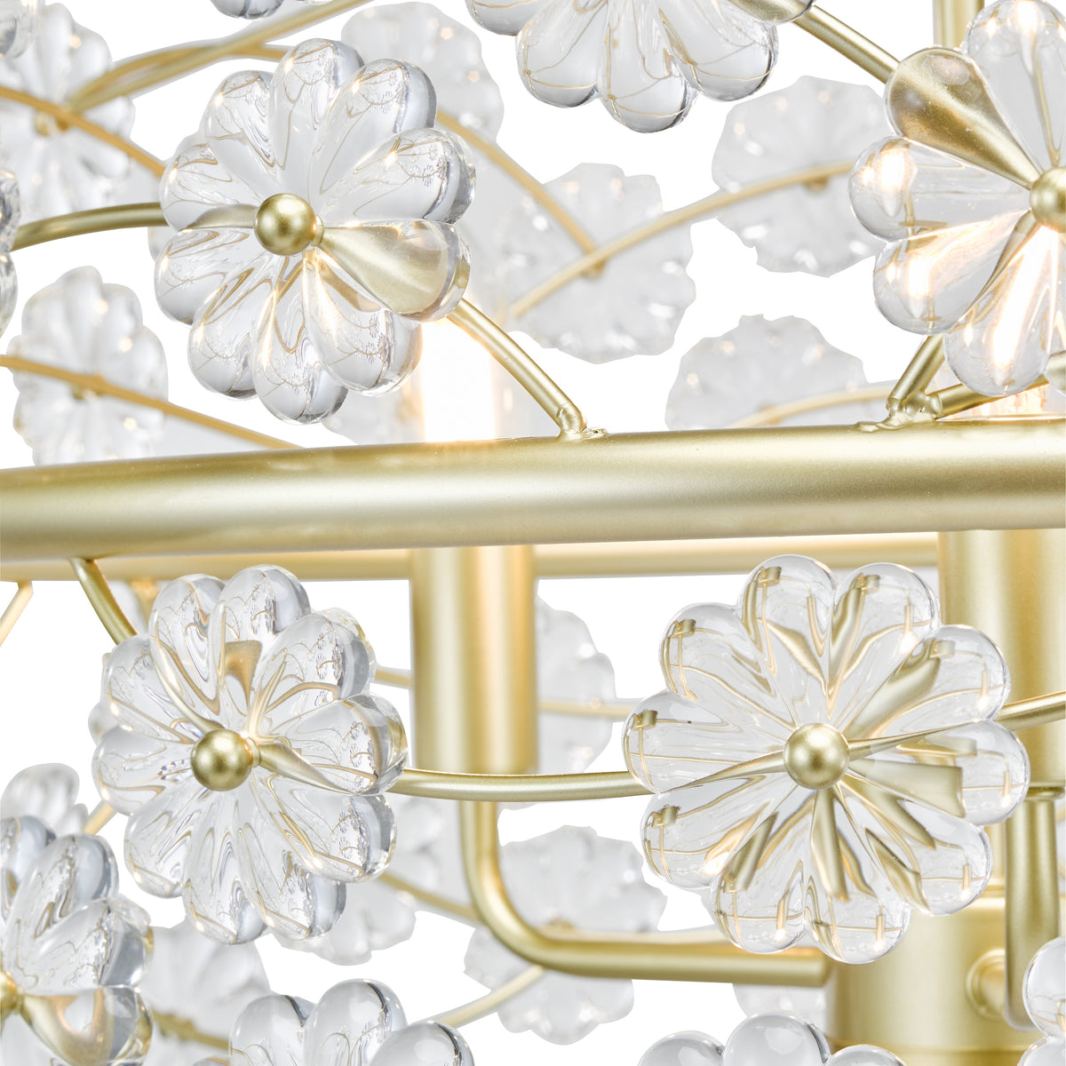 Close up of a gold chandelier with clear glass flower-shaped shades