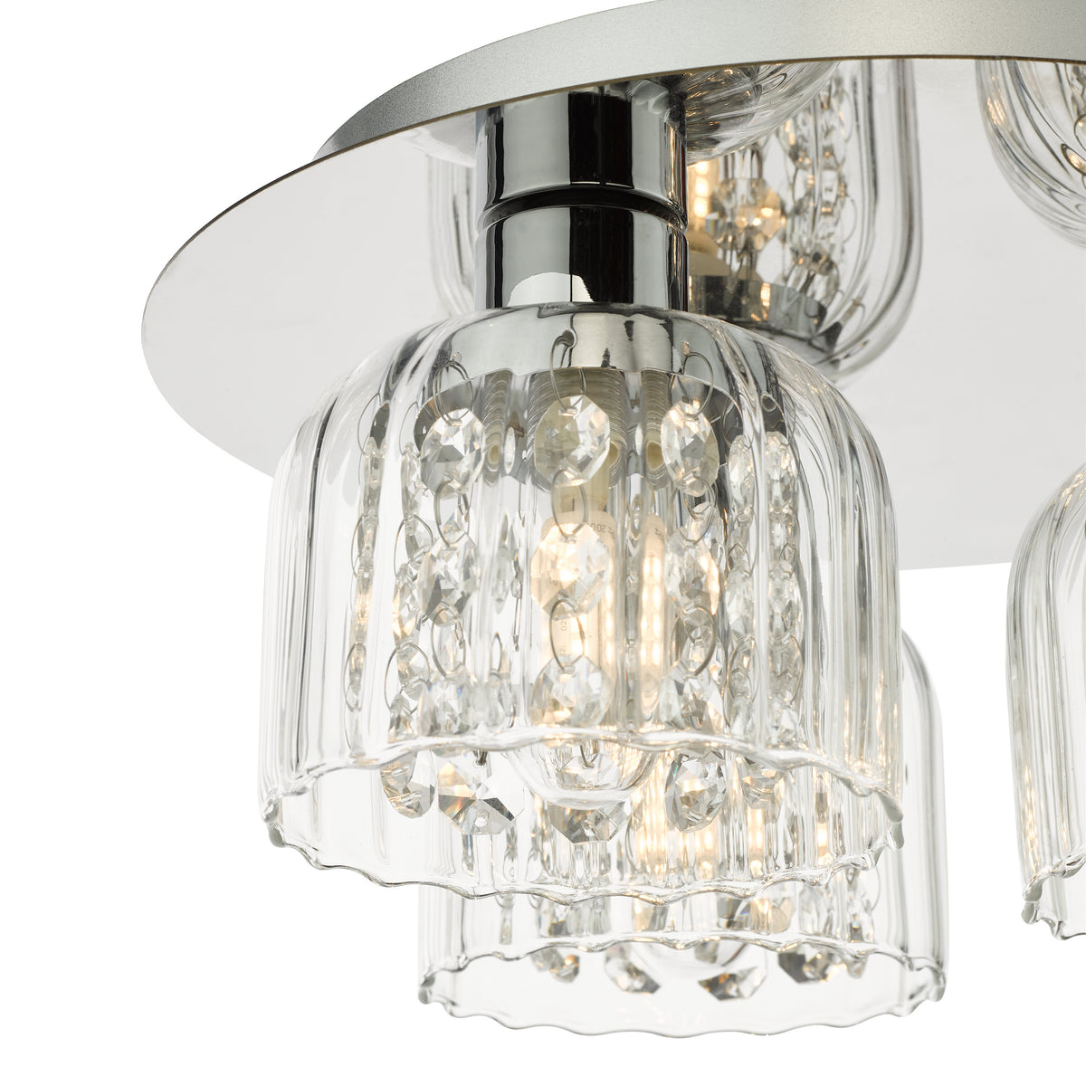 Close up of a modern crystal chandelier with clear glass shades and sparkling crystal accents
