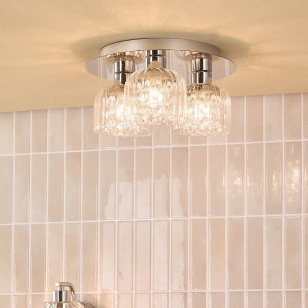 Three light ceiling fixture with clear textured glass shades and chrome base