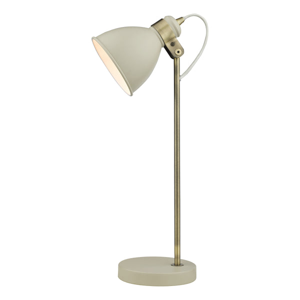 Cream and brass desk lamp with a round base and adjustable head