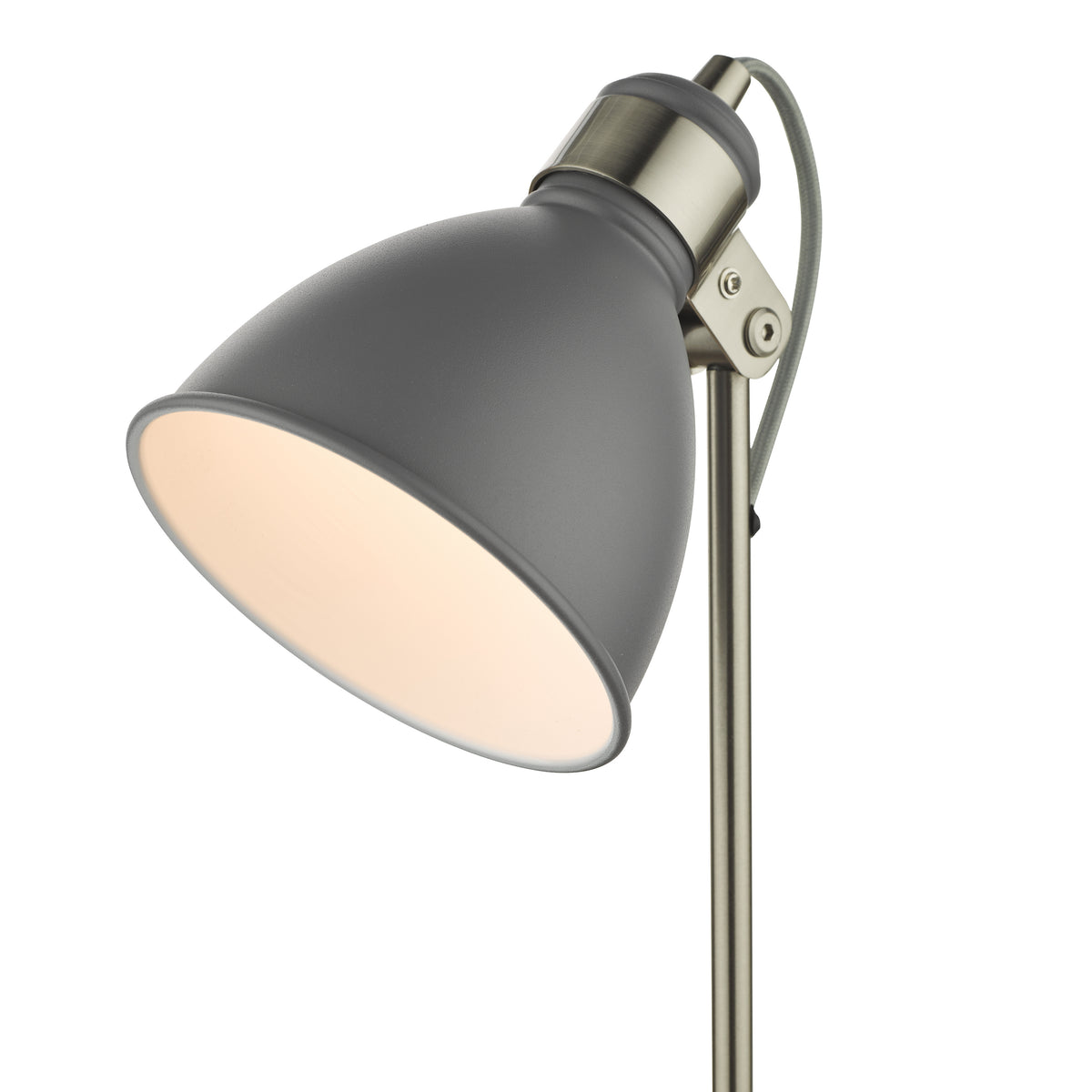 Grey metal desk lamp with a brushed brass adjustable neck and a grey fabric cord