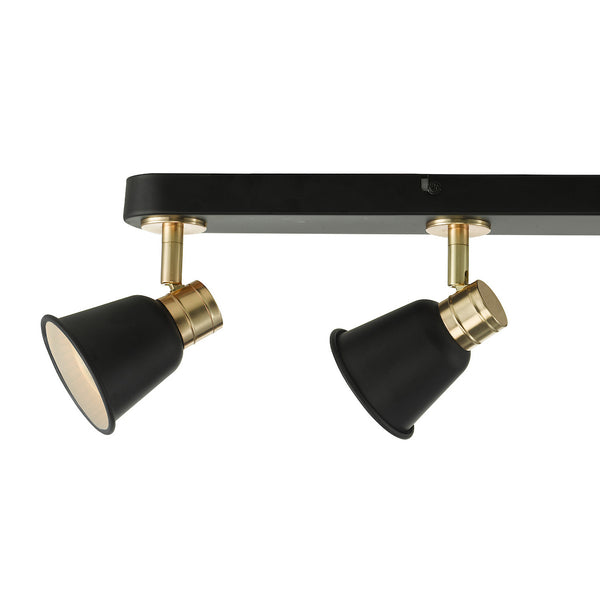 Two black and brass adjustable track lights on a black track