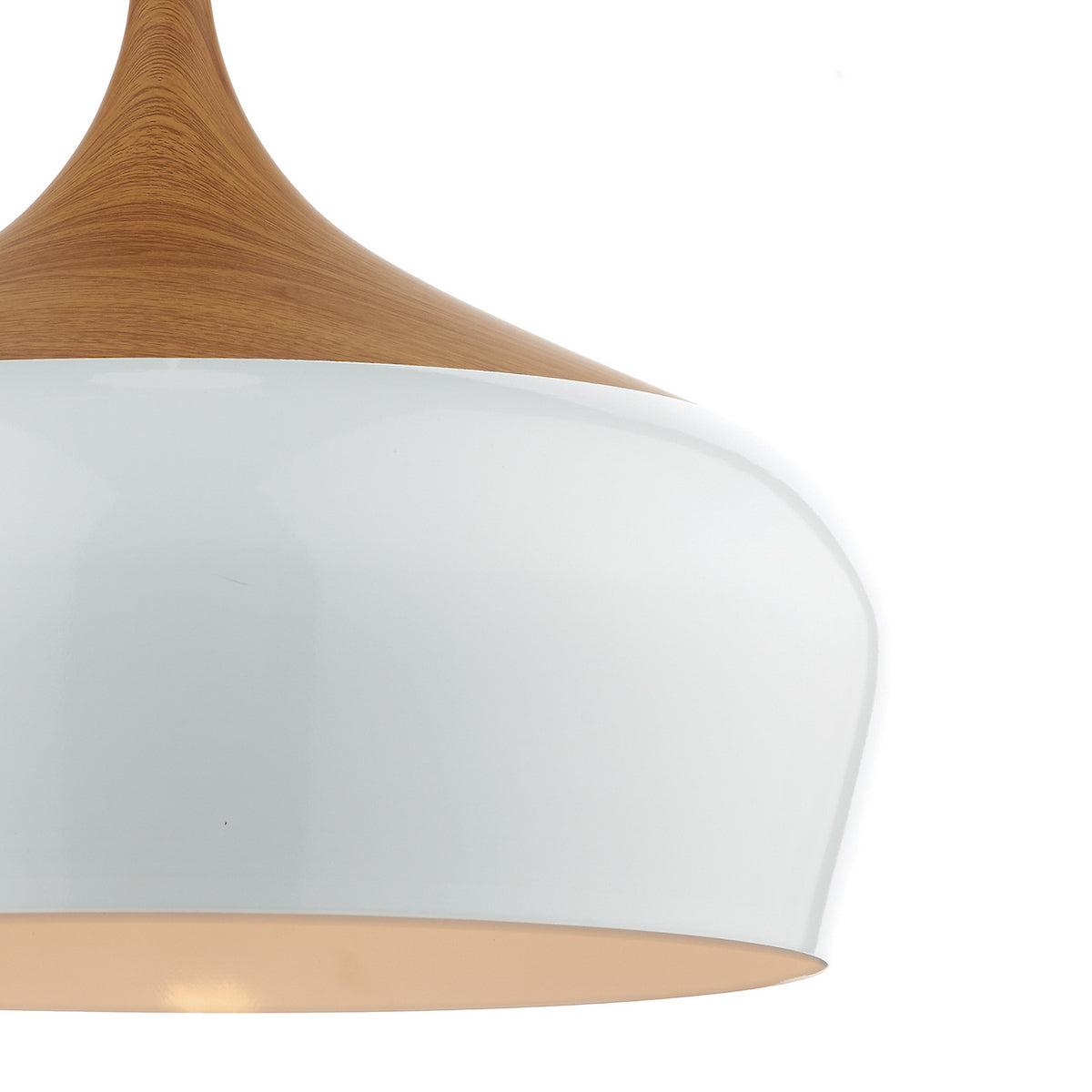 Close-up of a white and wood pendant light with a warm glow.