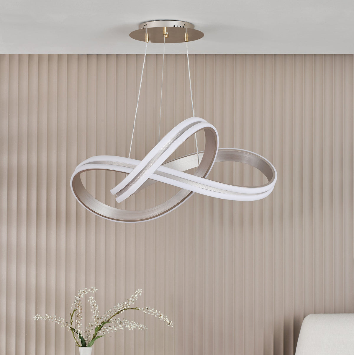 Modern LED chandelier with a double loop design in white and silver, hanging from a ceiling mount