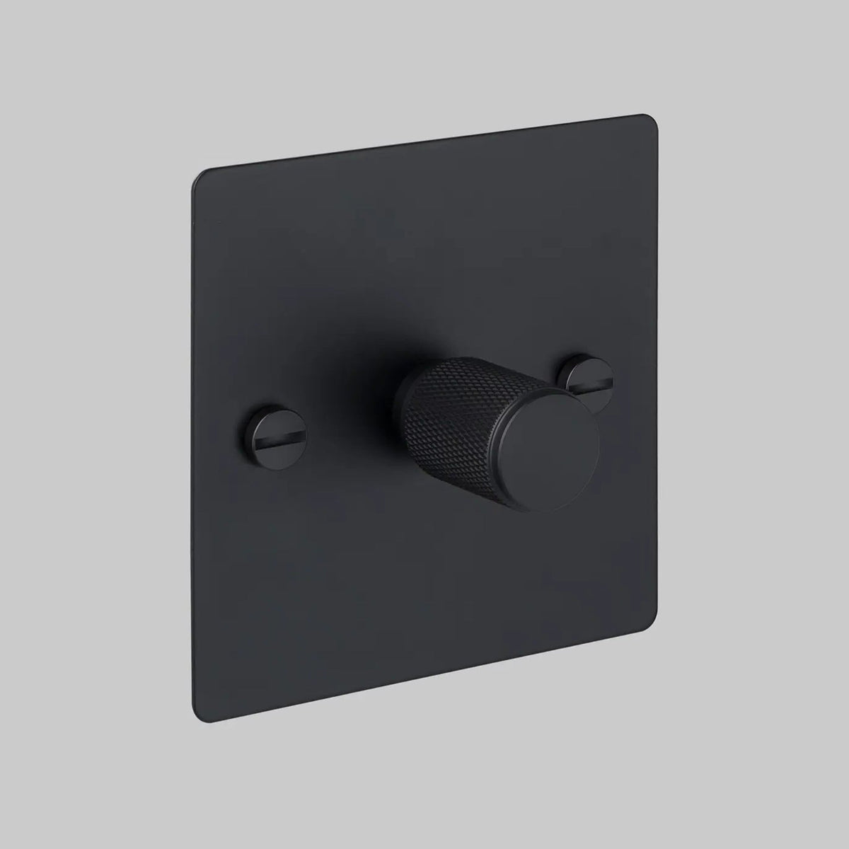 Black dimmer switch with a textured knob and two visible screws