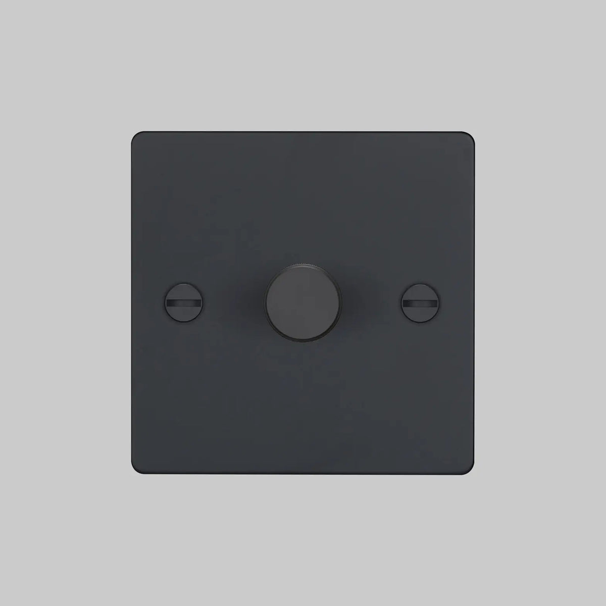 Black dimmer switch with a single rotary knob and two visible screws on a light grey background