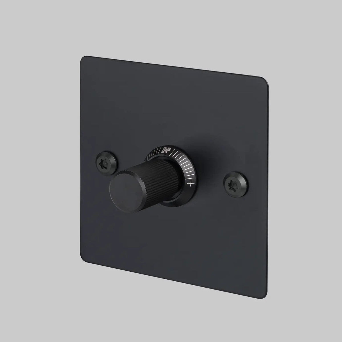Black dimmer switch with a ridged knob and white markings on a square plate