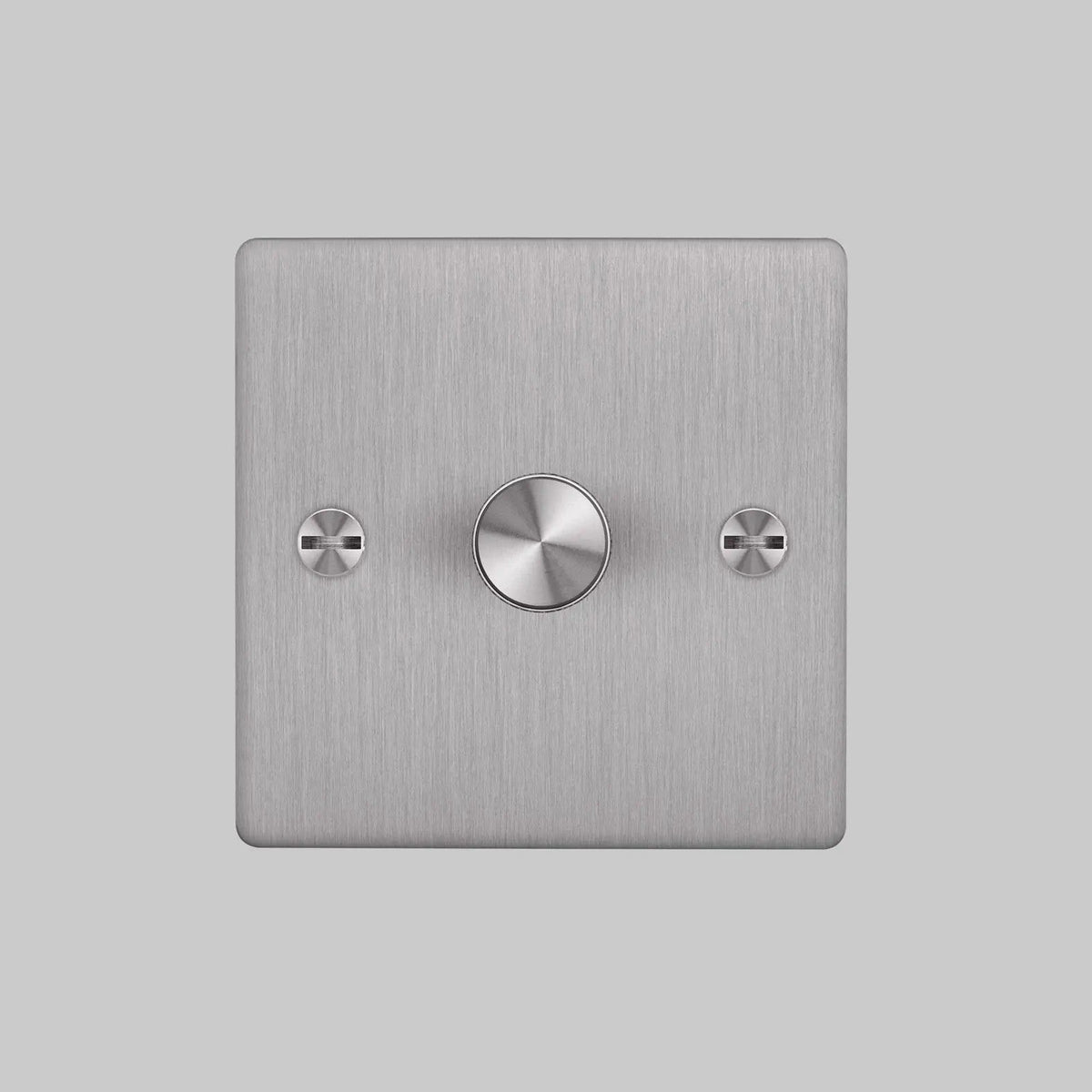 Brushed metal dimmer switch with a single round knob and two visible screws