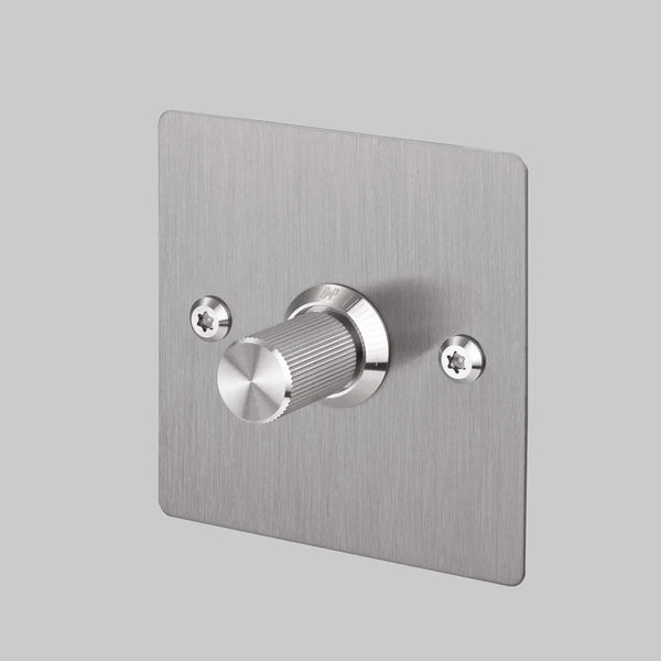 Brushed stainless steel dimmer switch with a single ridged knob and two visible screws