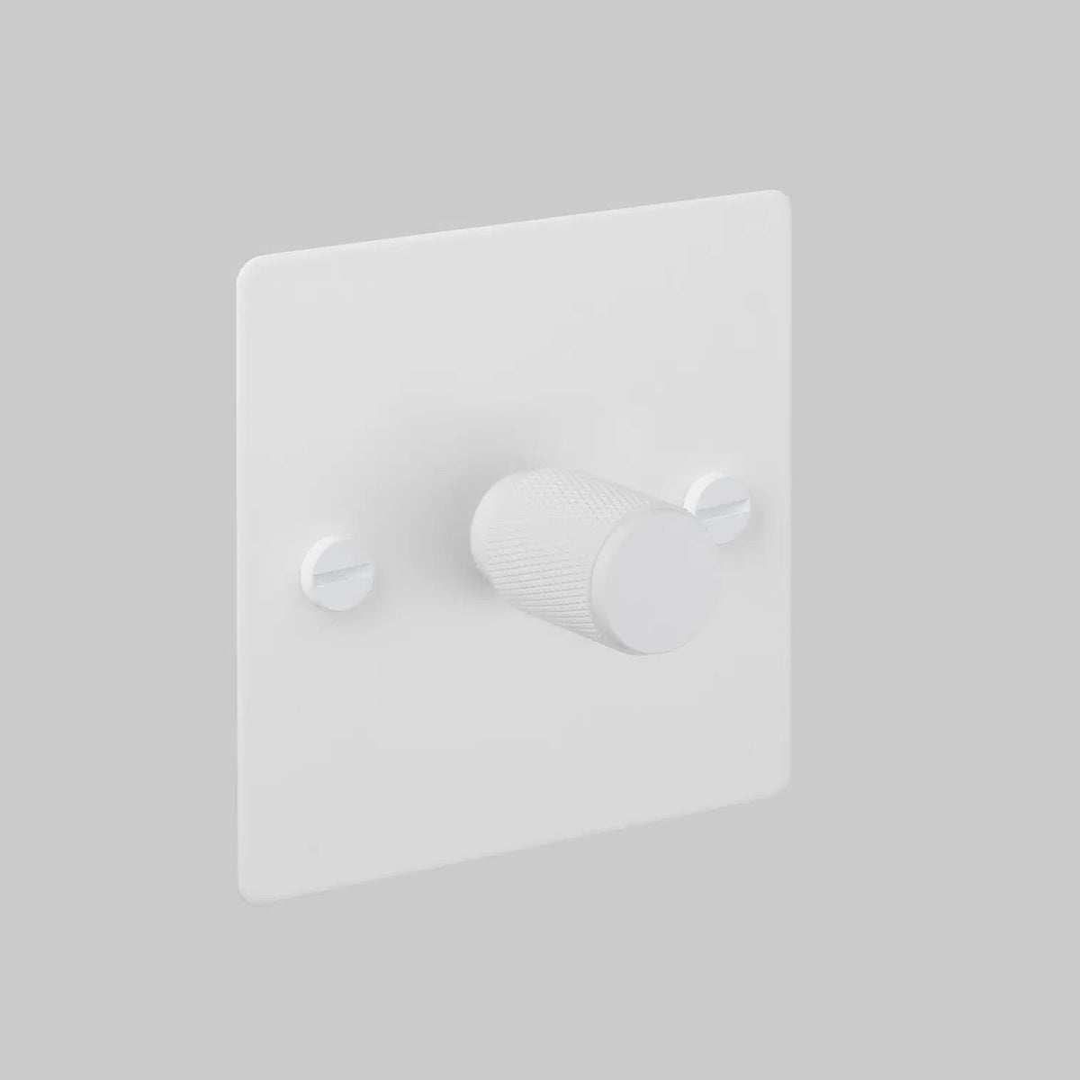 White dimmer switch with a textured knob and two visible screws
