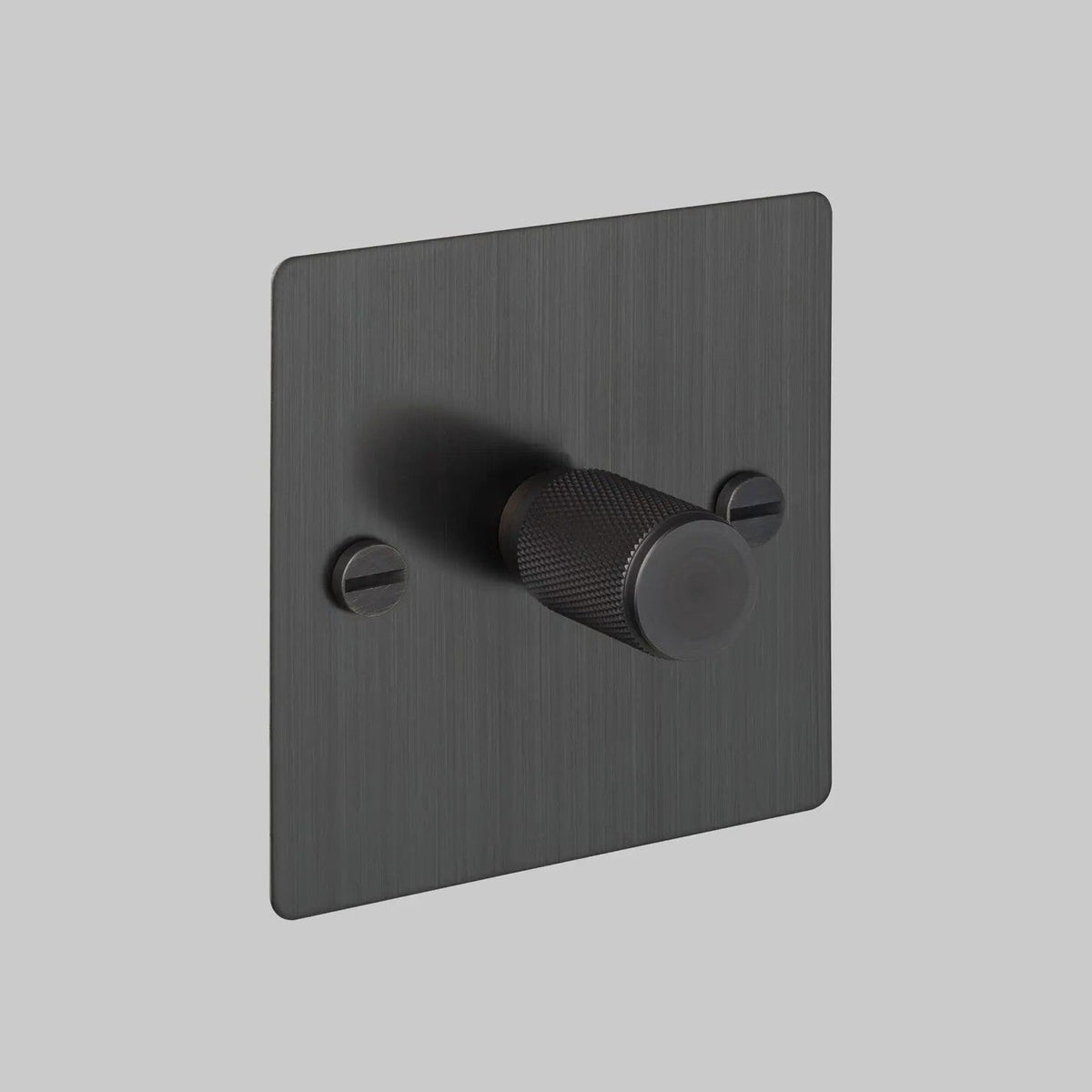 Single dimmer switch in black with a textured knob and visible screws