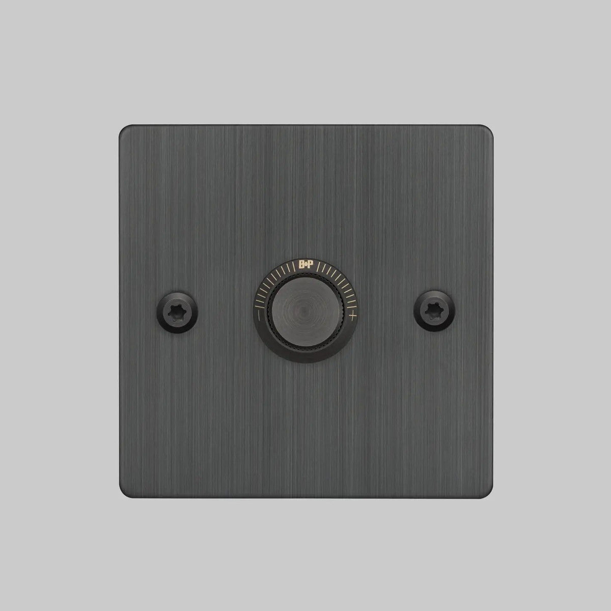 Square black dimmer switch with a central rotary knob and two visible screws