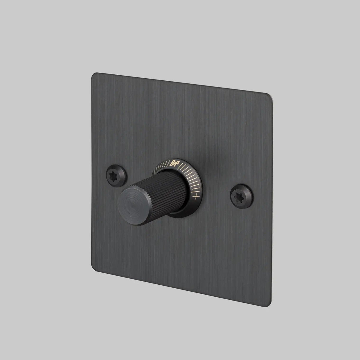 Black dimmer switch with a textured knob and a brushed metal faceplate