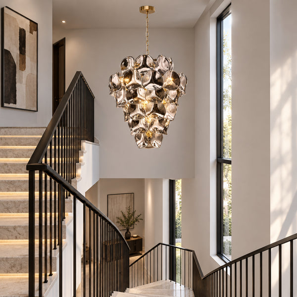 Genoa Twelve Light Chandelier in Natural Brass with Smoked Glass Panels