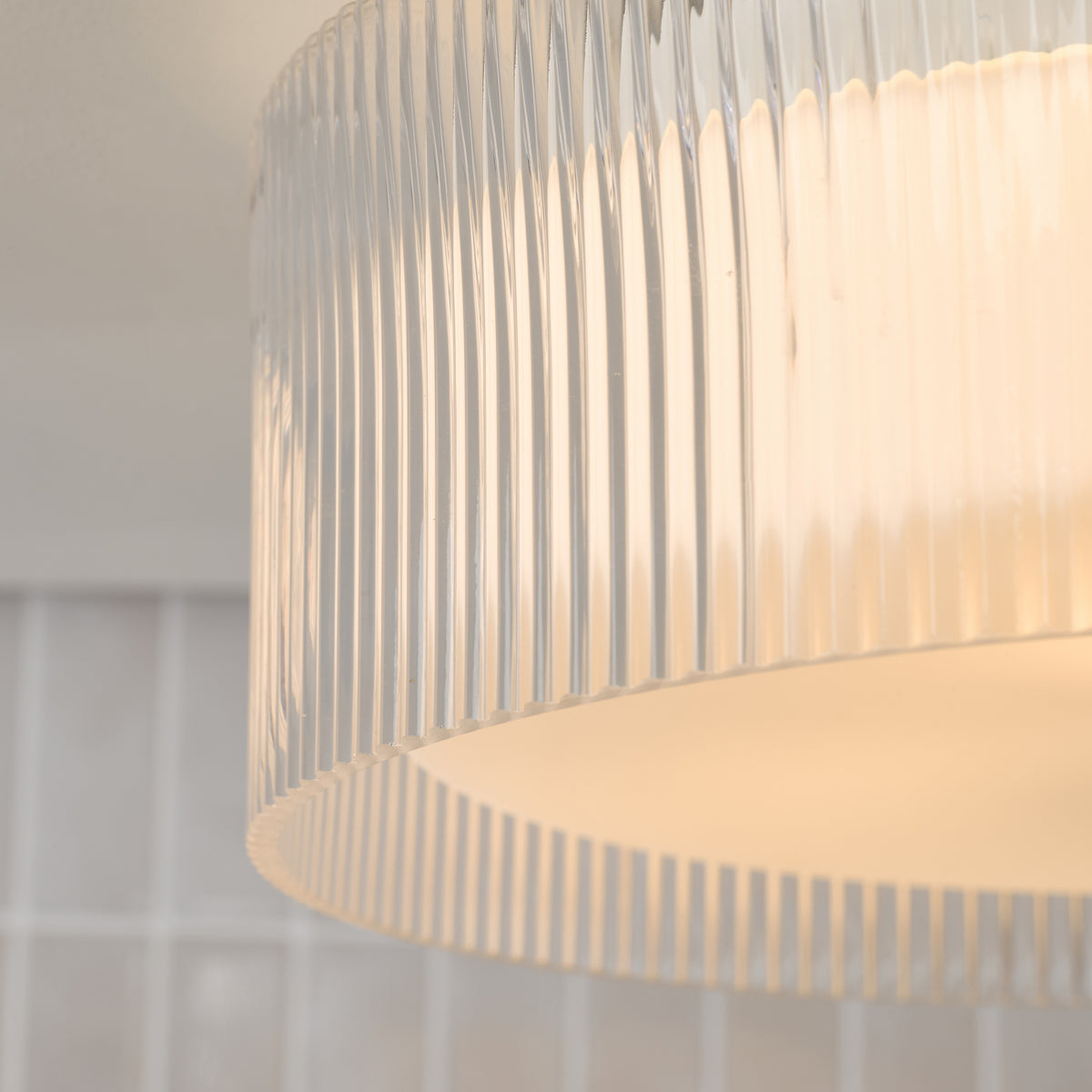 Geryon IP44 Flush Ceiling Light In Polished Chrome with Ribbed Glass Shade