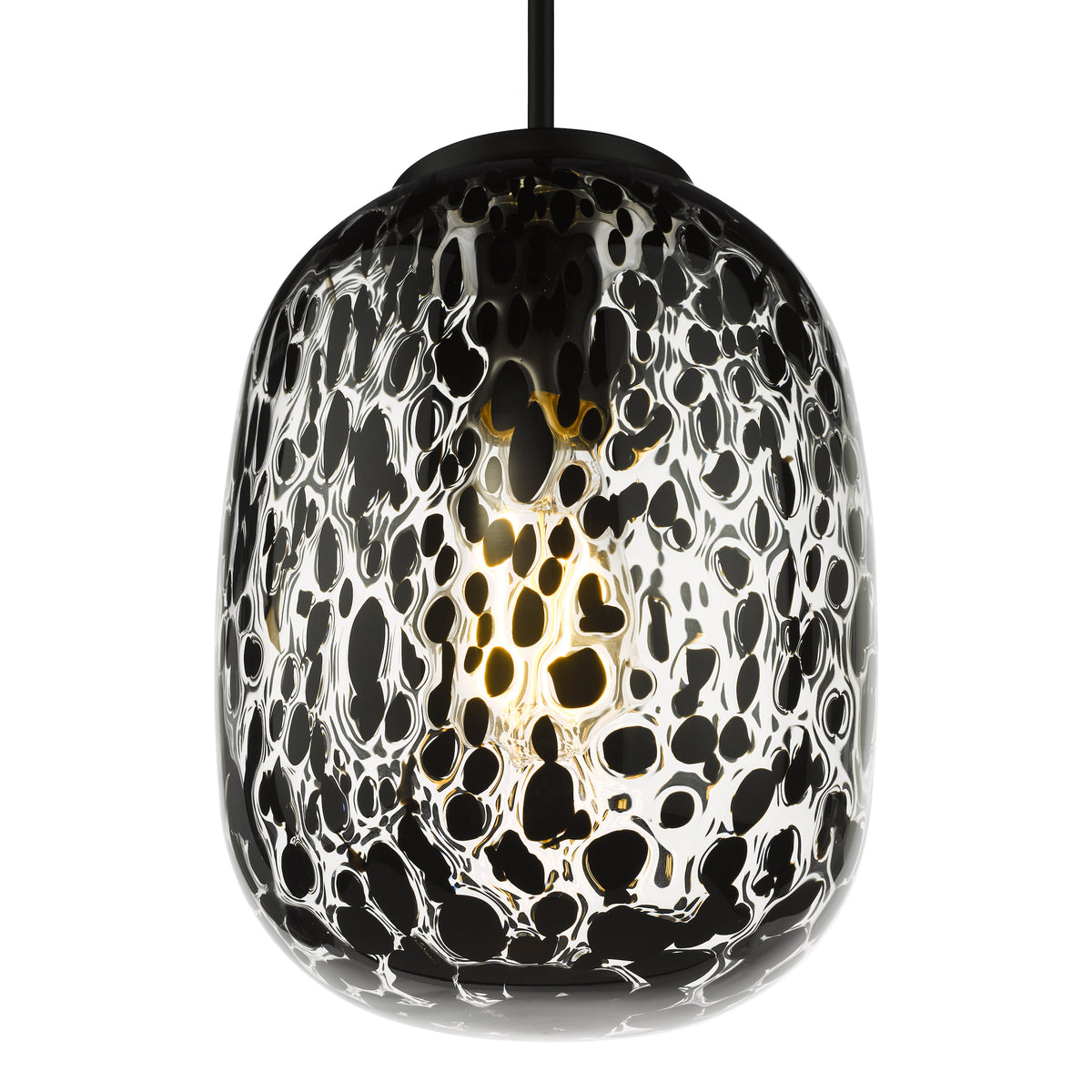 Black and white patterned glass pendant light with a glowing bulb inside