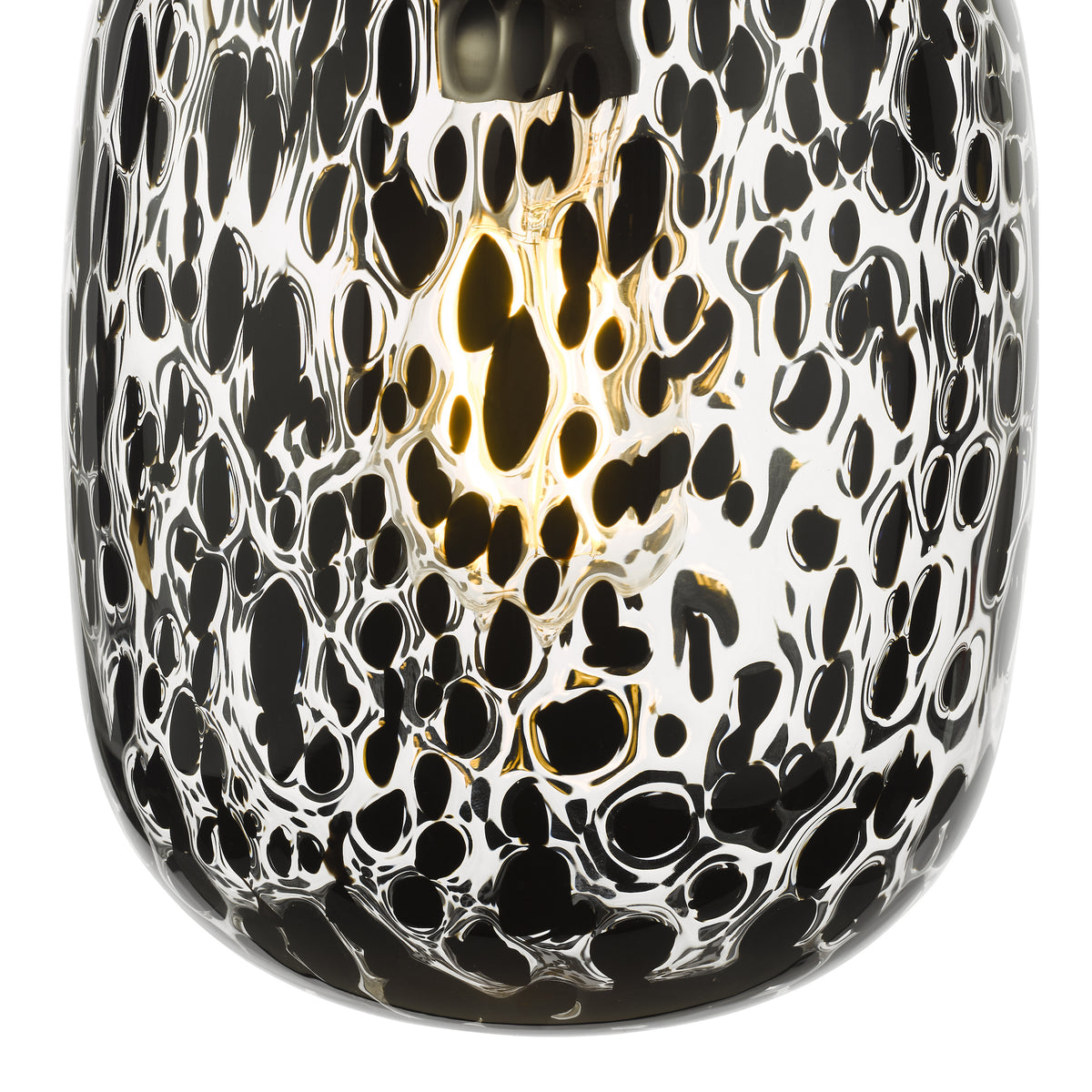 Close up of a black and white glass pendant light with a textured pattern