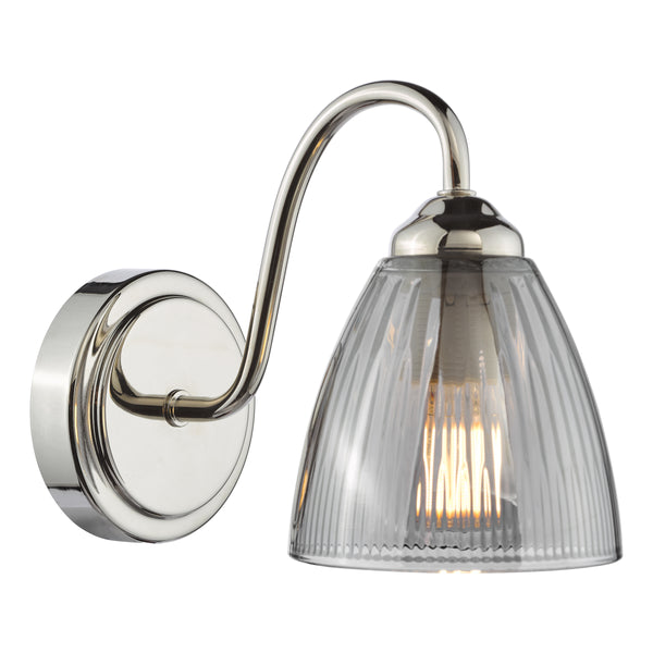 Polished nickel wall light with a curved arm and a ribbed clear glass shade