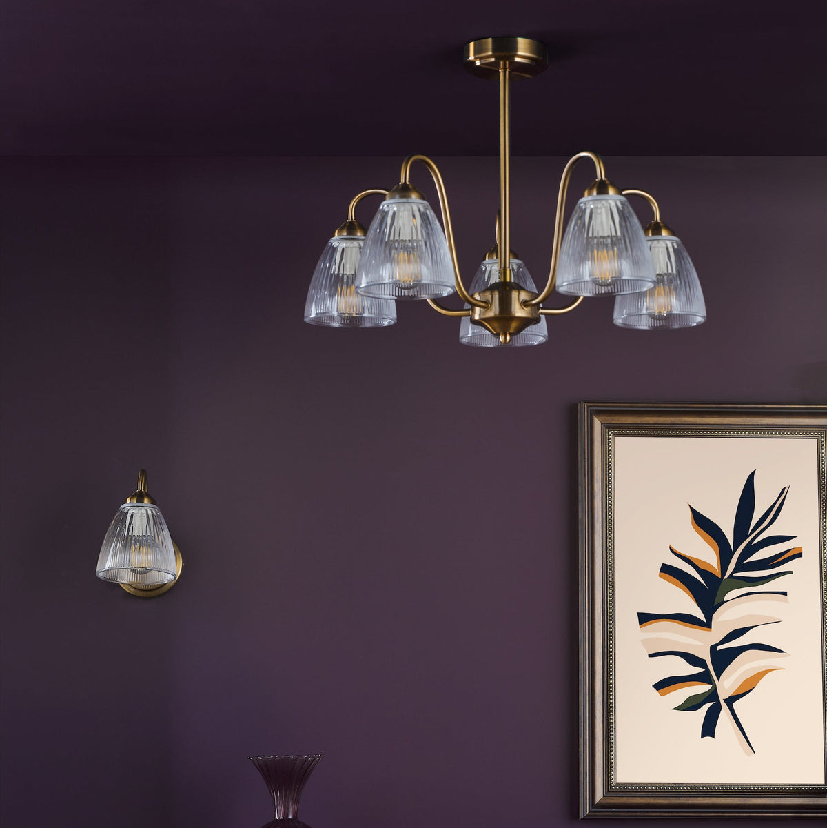 Five-arm chandelier and single wall light with ribbed glass shades and brass fittings
