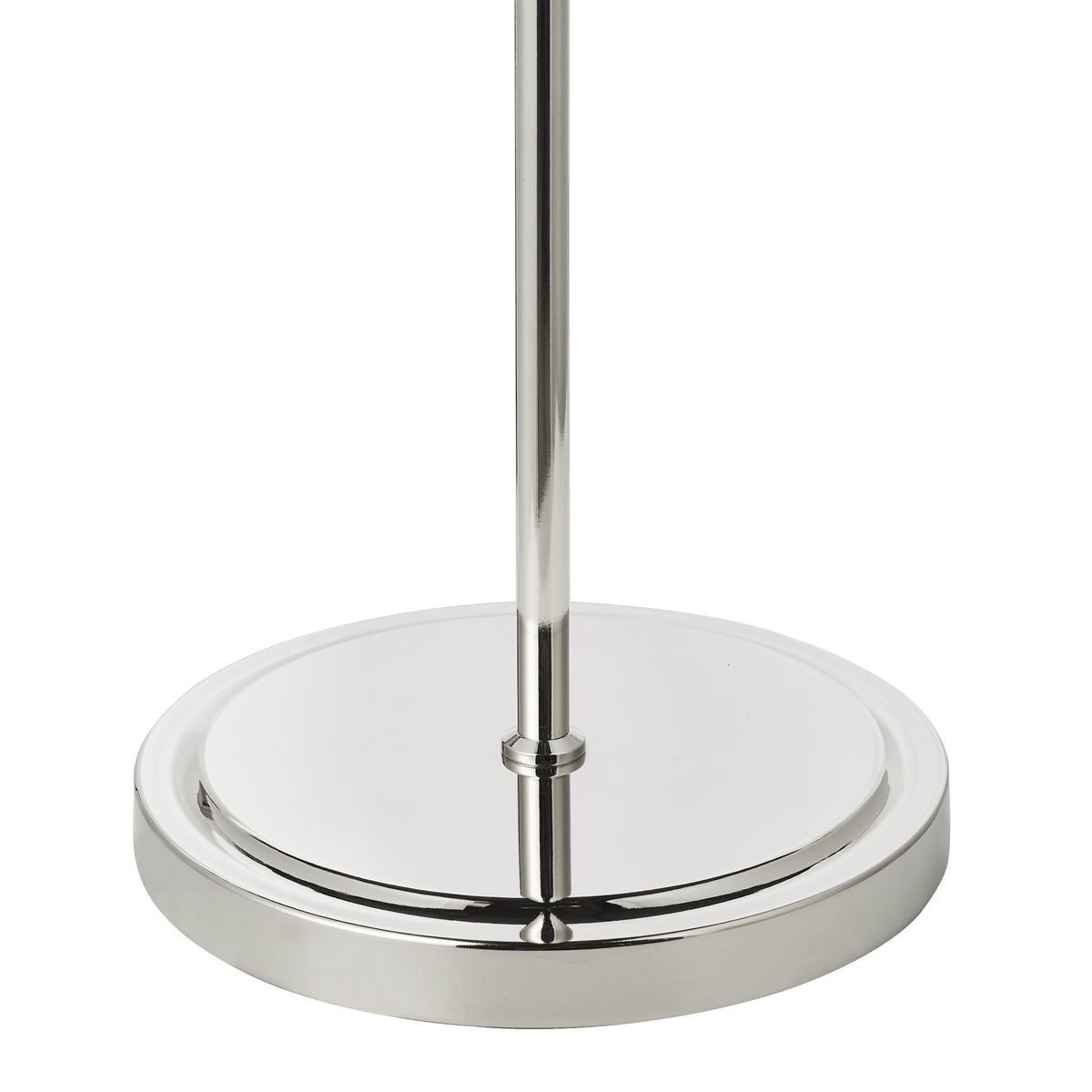 Chrome lamp base with a round, flat bottom and a slender pole extending upwards