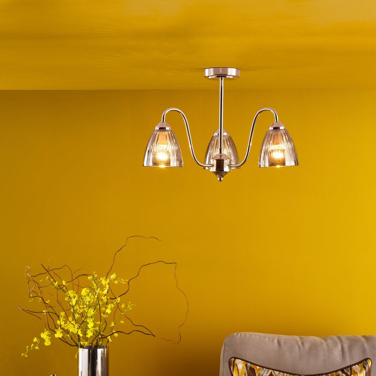 Three-light ceiling fixture with ribbed glass shades and polished chrome finish