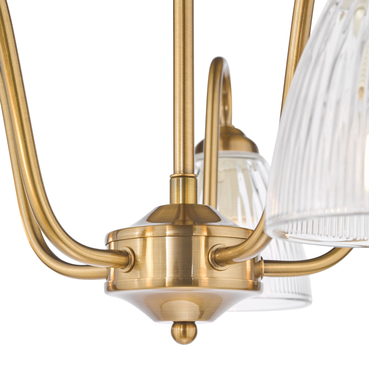 Close up of a brass chandelier with ribbed glass shades